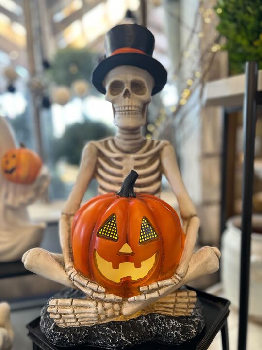 Skeleton Sitting w/ Black Hat & Pumpkin LCD Eyes